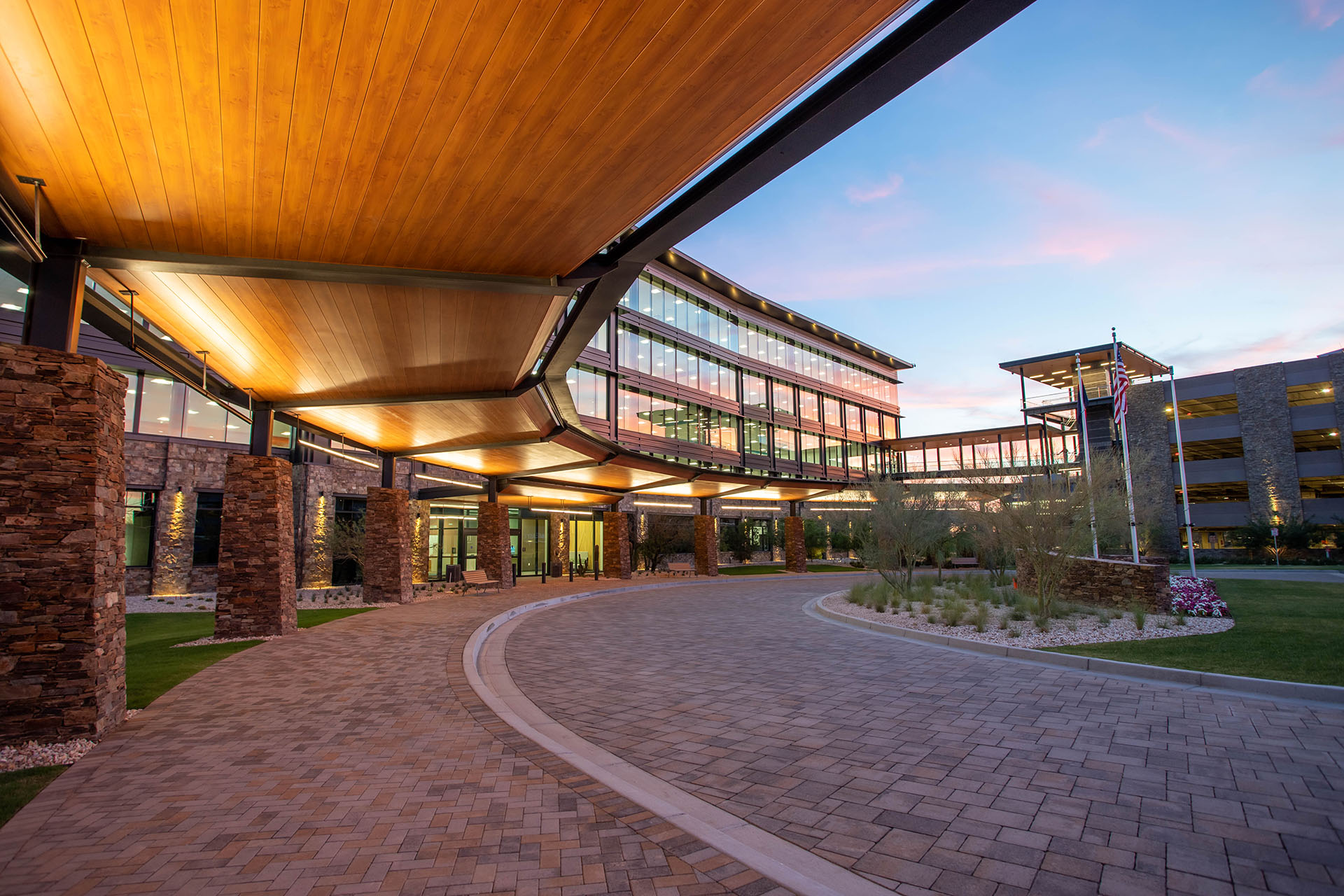 A curved walkway at Cavasson East Office Complex at dusk.