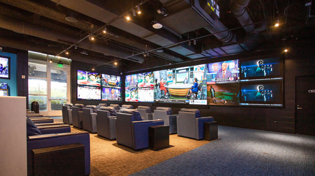 A large Arizona Sportsbook with a large number of televisions.