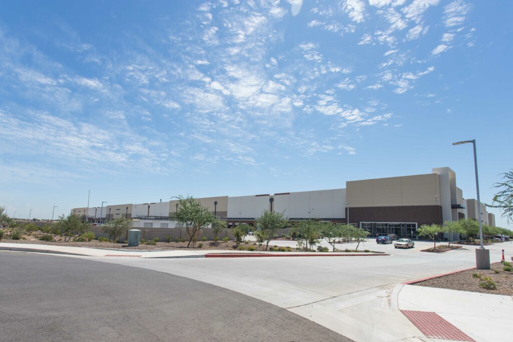 A large distribution center with a parking lot.