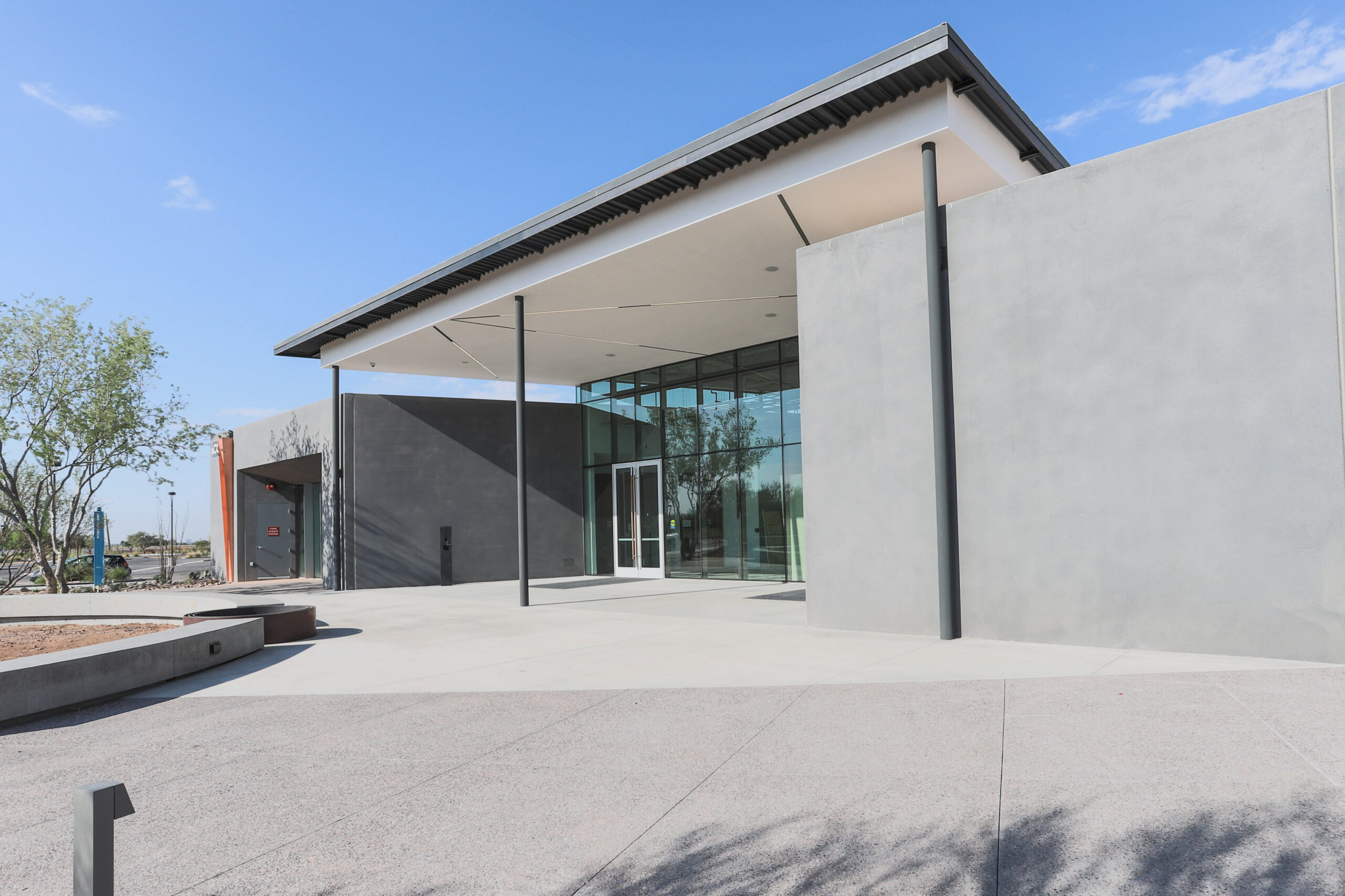 The exterior of Scottsdale Community College with a glass door.