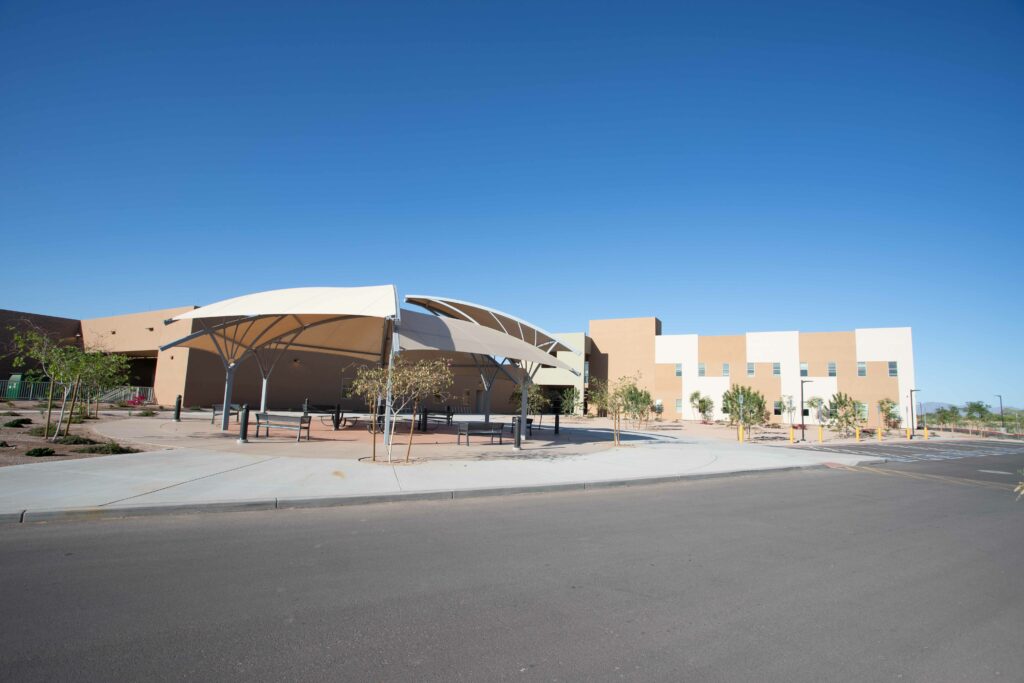 A Southeast Ambulatory Care Center building under a white canopy with a blue sky.