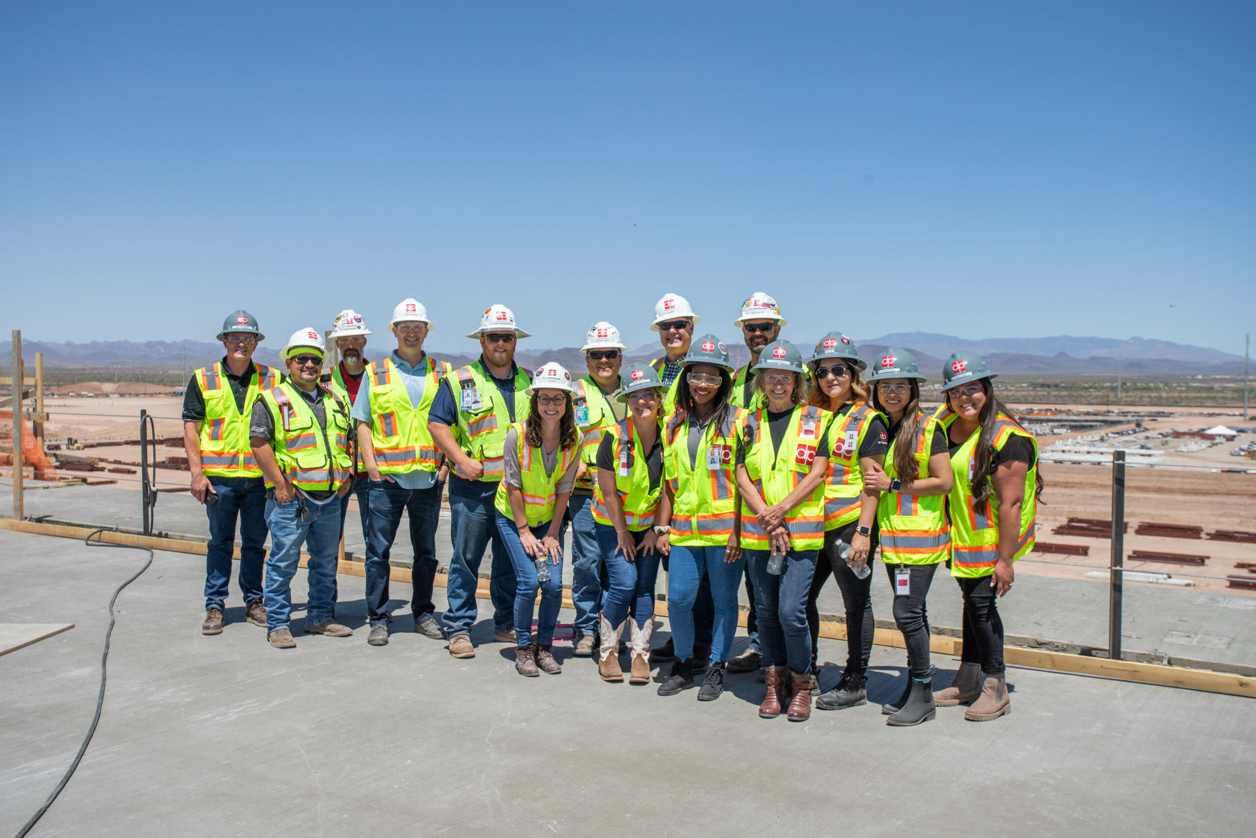 A group of construction workers posing for a photo, showcasing their careers.