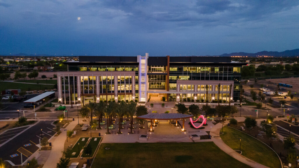An aerial view of the Goodyear Civic Square office building at dusk.
