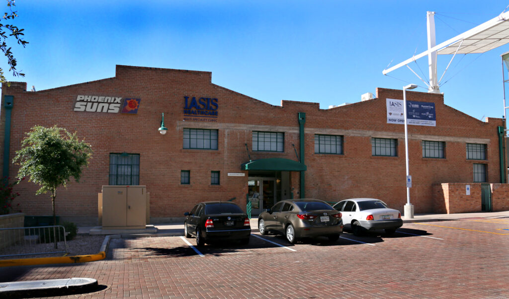 A brick building with IASIS Healthcare signage.