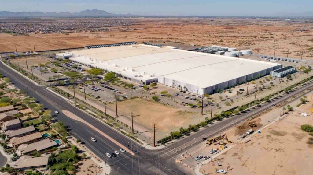 An aerial view of a large warehouse in the desert, Tilden.